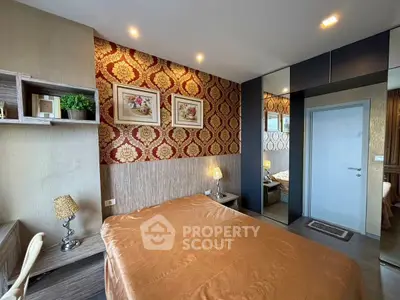 Luxurious bedroom with elegant wallpaper and modern furnishings