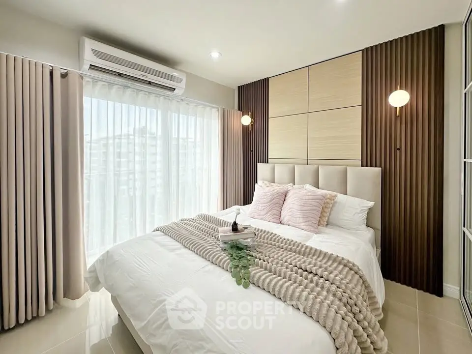 Modern bedroom with stylish decor and natural light