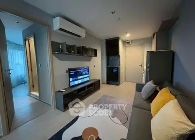 Modern living room with stylish decor and wall-mounted TV