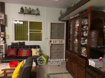 Cozy living room with eclectic decor and display cabinet