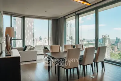 Luxurious high-rise dining area with stunning city views and modern decor