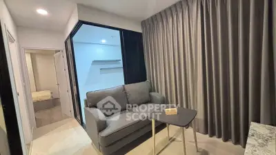 Modern living room with cozy sofa and elegant curtains in a stylish apartment.