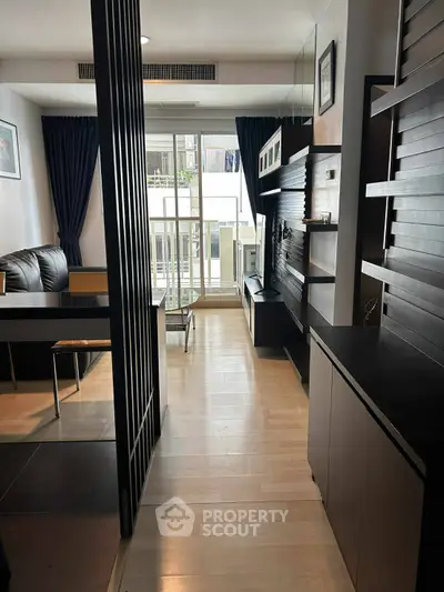 Modern living room with sleek furniture and balcony view