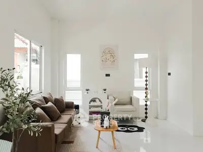 Bright and airy living room with modern furniture and natural light.