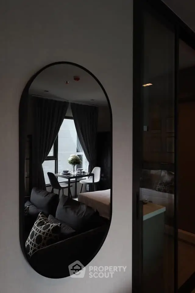 Modern living room with stylish decor and large window view