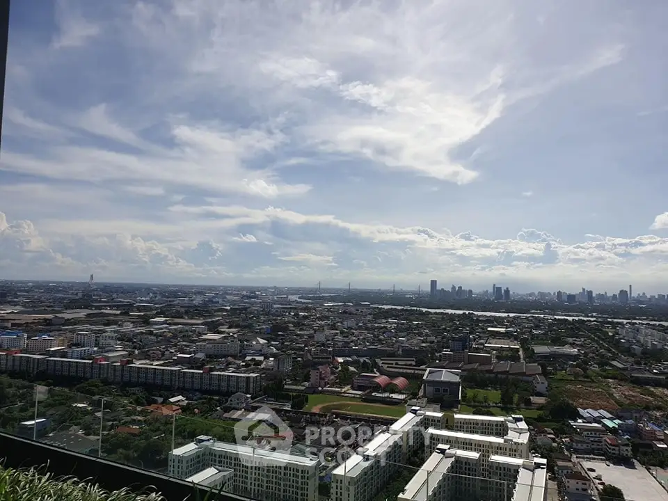 Stunning panoramic cityscape view from high-rise building balcony.