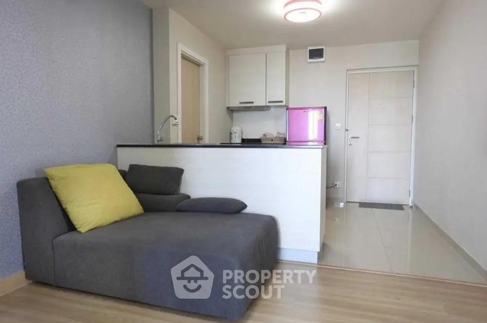 Modern compact living room with open kitchen and stylish decor