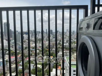 Stunning city view from high-rise balcony with modern washing machine.