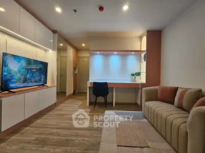 Modern living room with stylish decor, featuring a cozy sofa, sleek TV unit, and a functional study area.