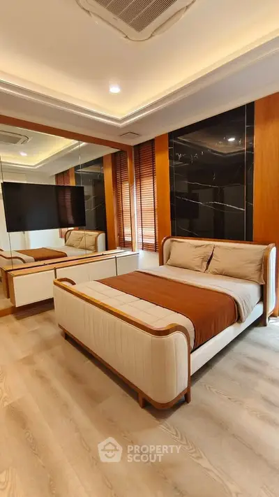 Luxurious modern bedroom with elegant design and mirrored accents