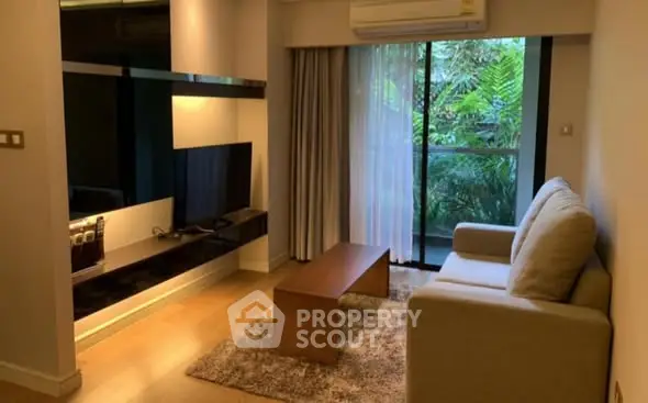 Cozy living room with modern decor and garden view balcony