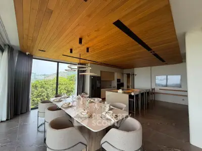 Luxurious open-plan dining area with stunning views and modern decor