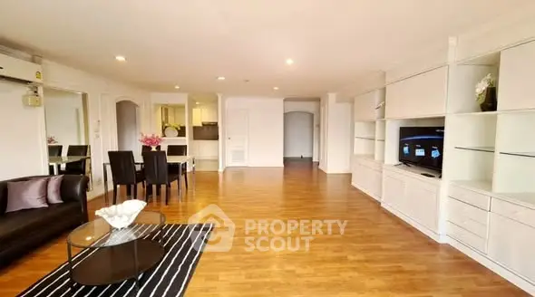 Spacious living room with modern furniture and open layout, perfect for entertaining.