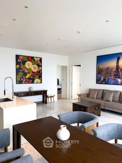 Spacious modern living room with elegant decor and cityscape artwork.