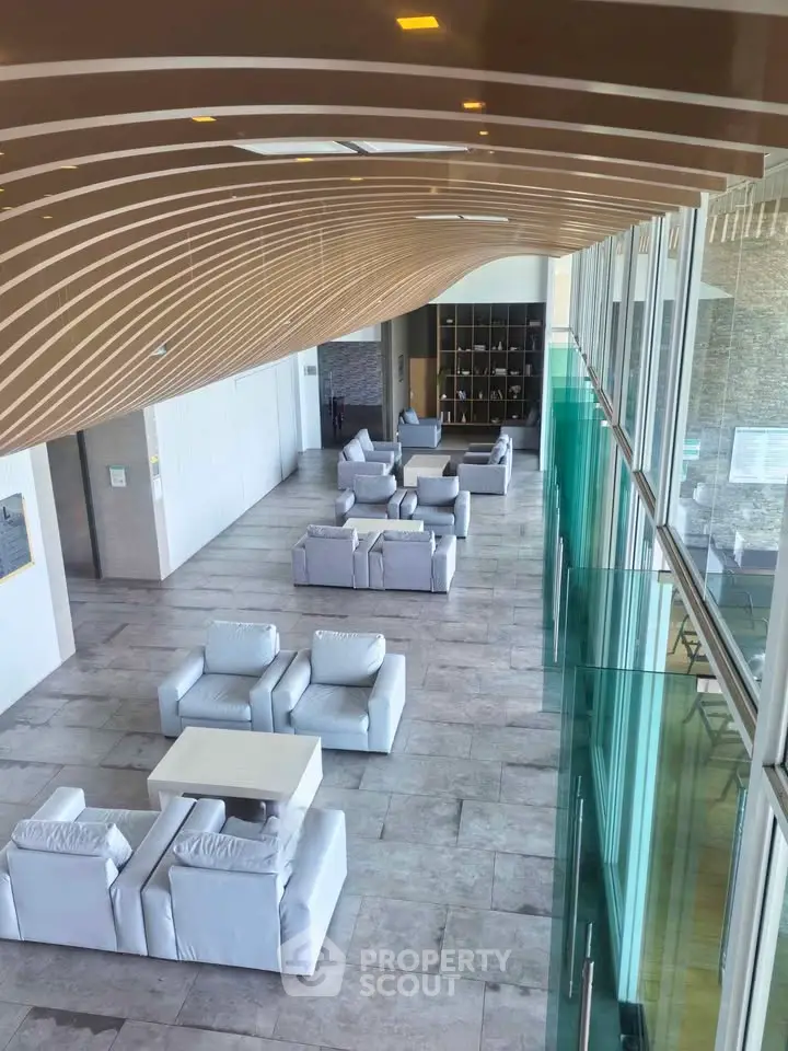 Luxurious modern lobby with stylish seating and elegant design elements in a high-end building.