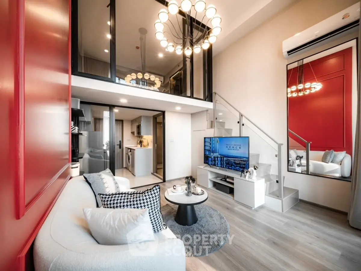 Modern loft apartment with stylish living room and mezzanine, featuring elegant decor and open layout.