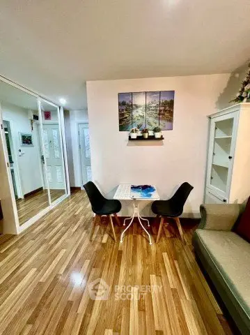 Charming living room with elegant decor and wooden flooring, perfect for cozy gatherings.
