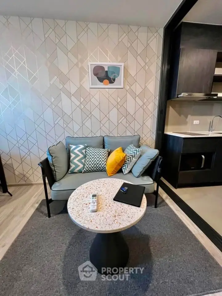 Stylish modern living room with cozy sofa and chic decor in open layout apartment.