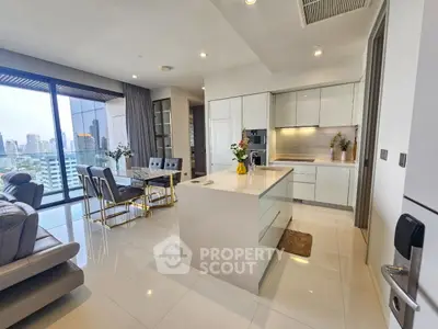 Luxurious open-plan kitchen and living area with city view