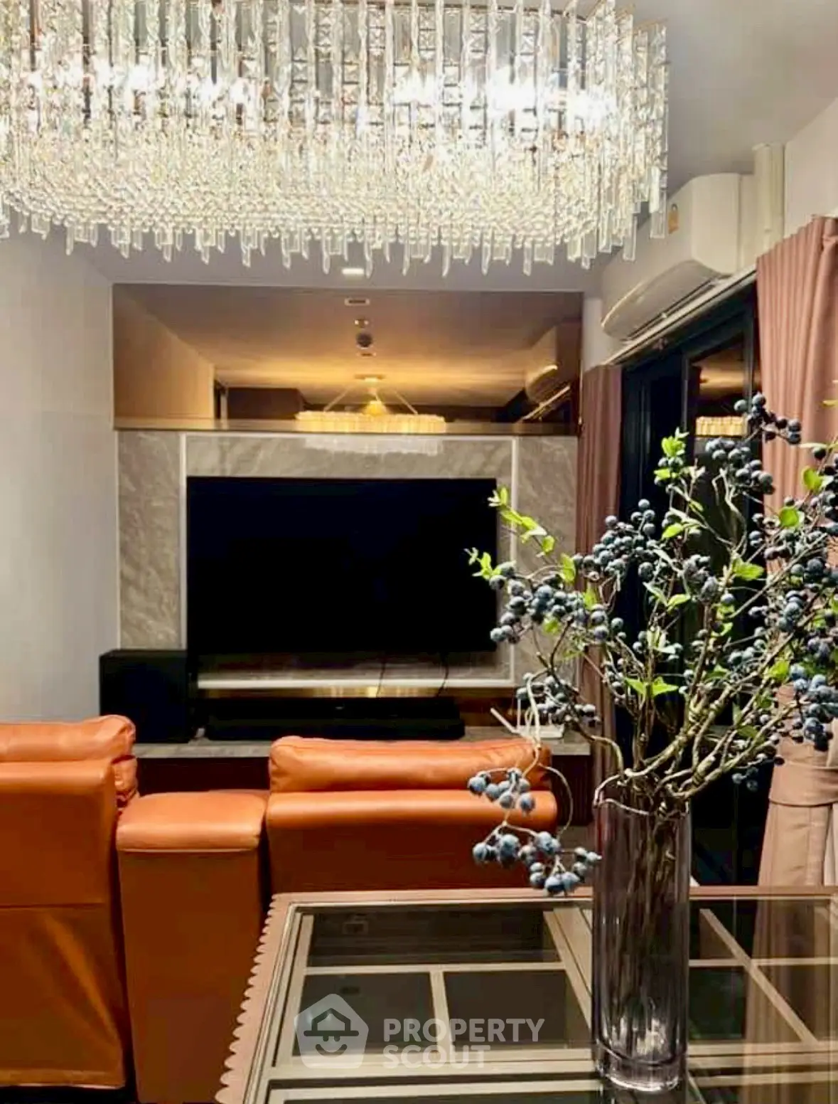 Luxurious living room with elegant chandelier and modern decor