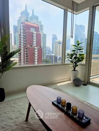 Modern living room with stunning city view, featuring stylish decor and large windows for natural light.