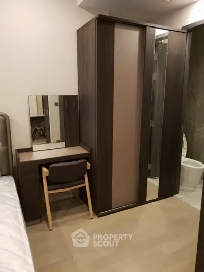 Modern bedroom with sleek wardrobe and compact dressing table