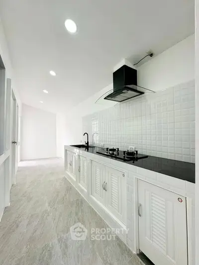 Sleek modern kitchen with gas stove and minimalist design