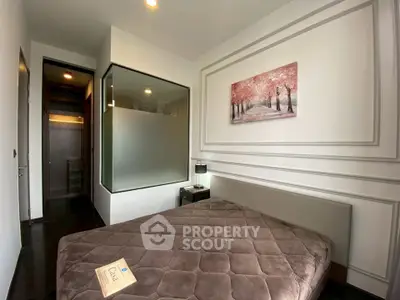 Cozy modern bedroom with elegant decor and frosted glass partition