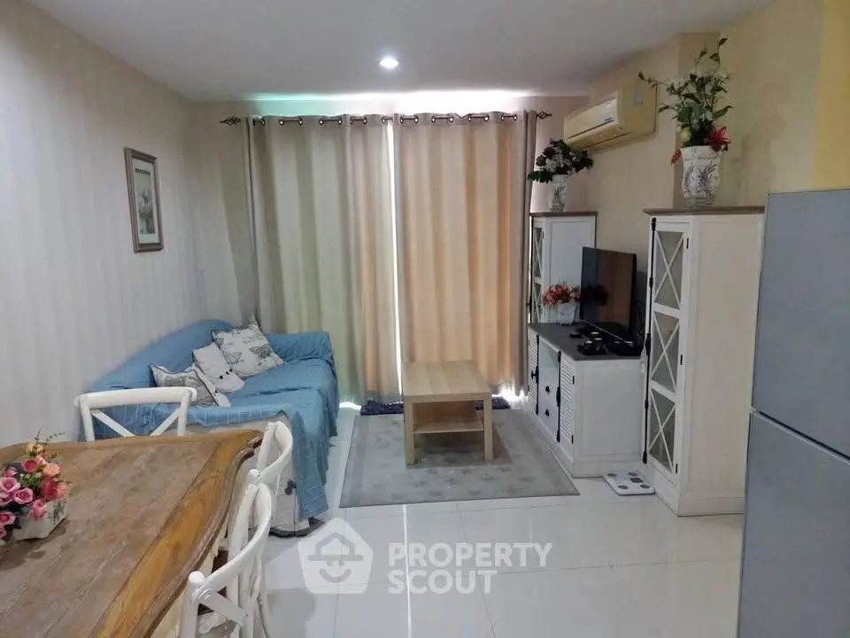 Charming living room with cozy seating and modern decor, perfect for relaxation and entertainment.