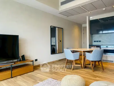 Modern living room with stylish furniture and open kitchen layout