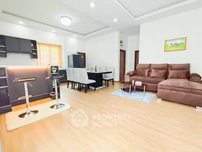 Spacious modern living room with open kitchen and stylish decor