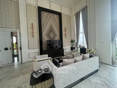 Luxurious living room with high ceilings and elegant decor, featuring a stunning city view.