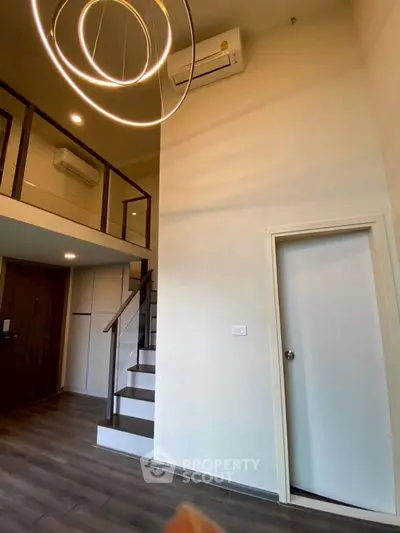 Modern loft apartment with high ceilings and stylish lighting