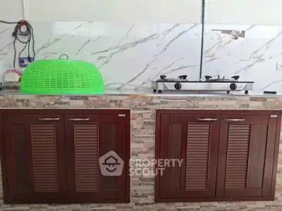 Modern kitchen with gas stove and stylish cabinetry