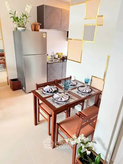 Charming kitchen with dining set and modern appliances in cozy apartment.