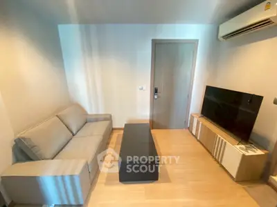 Modern living room with sleek furniture and air conditioning in a cozy apartment.