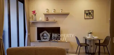 Modern living room with stylish decor and wall-mounted TV