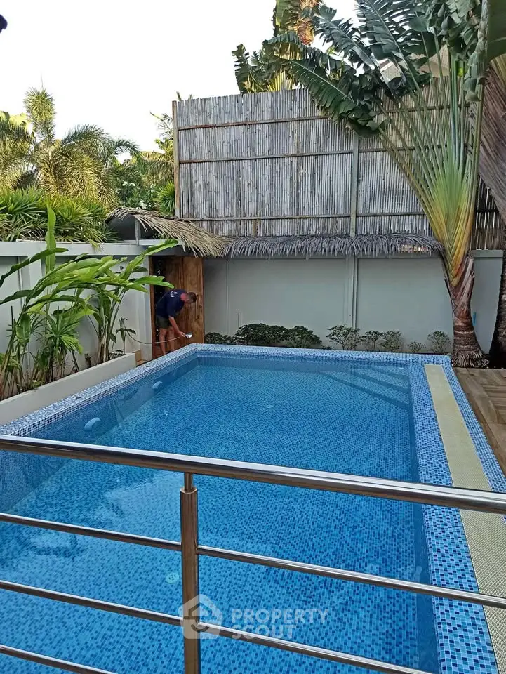 Stunning private pool area with lush greenery and modern design, perfect for relaxation and entertainment.