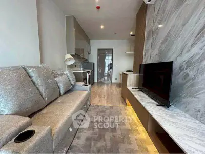 Modern living room with sleek design, featuring a plush sofa and wall-mounted TV for ultimate comfort.