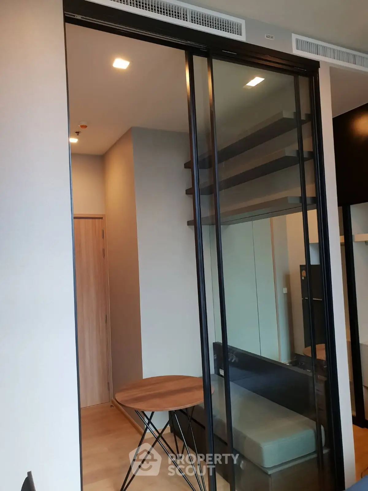 Modern interior with sliding glass doors and stylish furniture