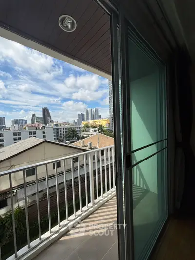 Charming balcony with cityscape view, perfect for urban living enthusiasts.