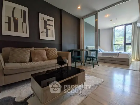 Modern open-plan living room with stylish decor and natural light