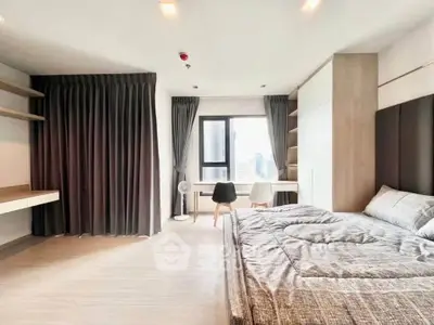 Spacious modern bedroom with city view and elegant decor