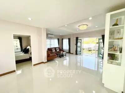 Spacious living room with elegant decor and open view to garden