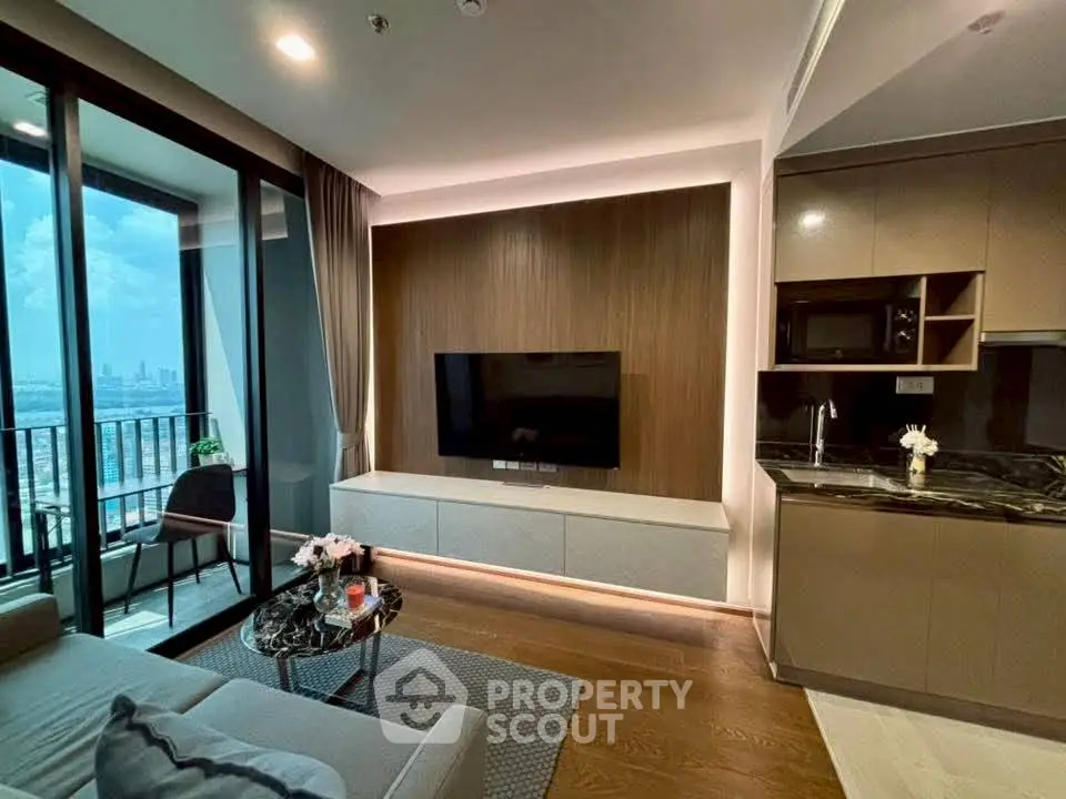 Modern living room with city view, sleek furniture, and stylish decor in a high-rise apartment.
