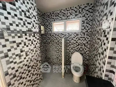 Modern bathroom with mosaic tile design and sleek fixtures