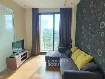 Modern living room with large window and stylish decor