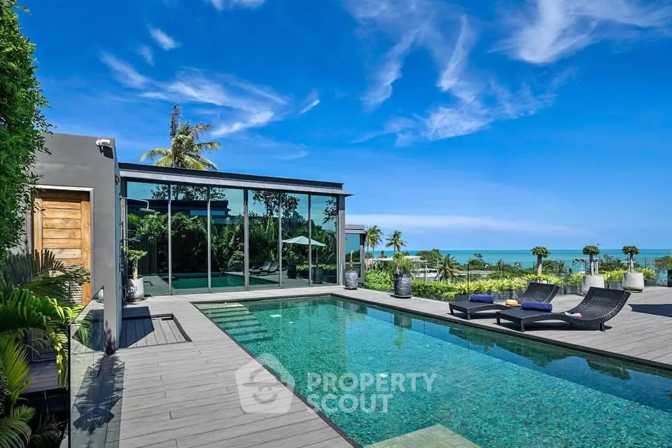 Luxurious modern villa with stunning ocean view and private pool, perfect for relaxation and entertainment.