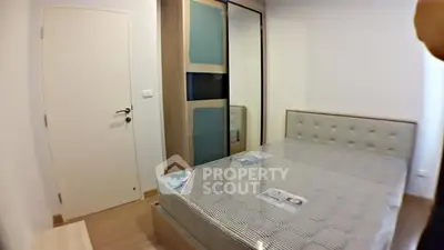 Modern bedroom with stylish wardrobe and comfortable bed