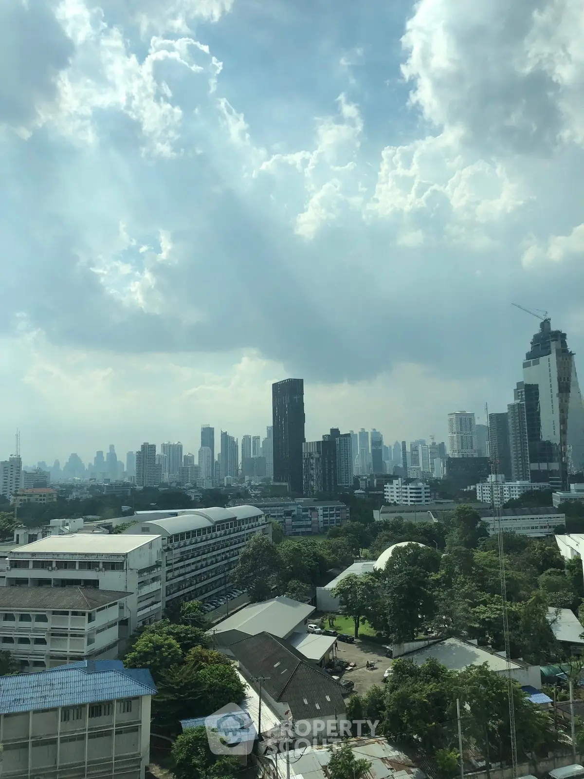 Stunning cityscape view showcasing modern skyline and lush greenery, perfect for urban living enthusiasts.
